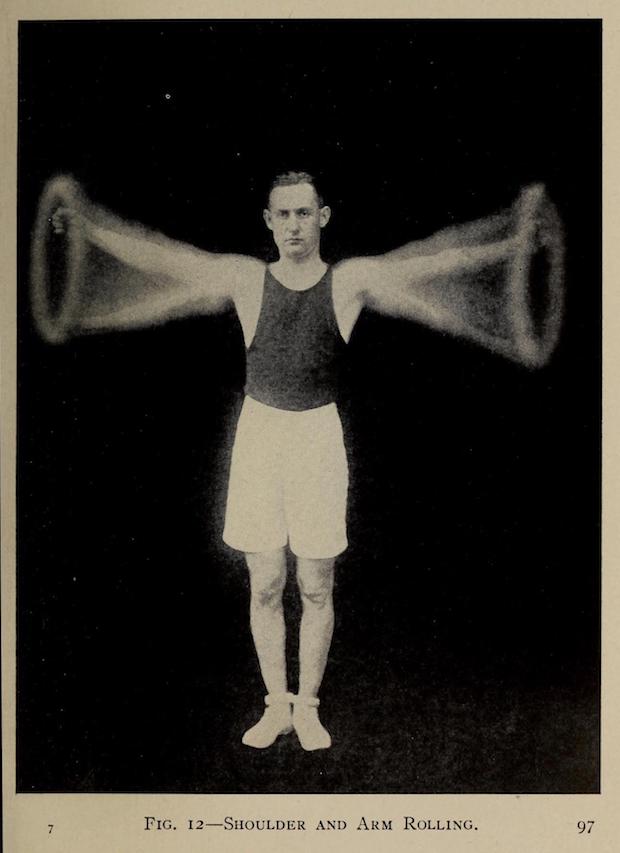 An athletic 1917 business man with black tank top, white knee-length shorts, white tennis shoes, and dark hair neatly parted and just beginning to receded. A composite pose of him exercising. In this case circling his arms while looking debonairly ahead. Face very serious and straight-ahead. This businessman means business!